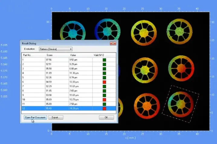 Color-coded surface flatness measurement results of multiple circular parts with numerical pass-fail flatness scores and micron tolerances.