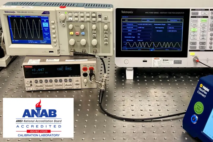 Advanced calibration laboratory setup with Tektronix oscilloscopes and signal generators, ANAB accredited for ISO/IEC 17025 compliance.