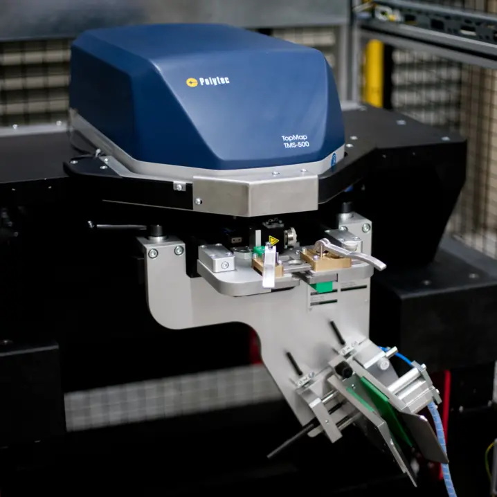 Polytec TopMap TMS-500 optical profilometer performing non-contact surface inspection for high-precision quality control.